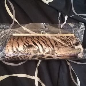 Cute animal print hand clutch with chain strap.